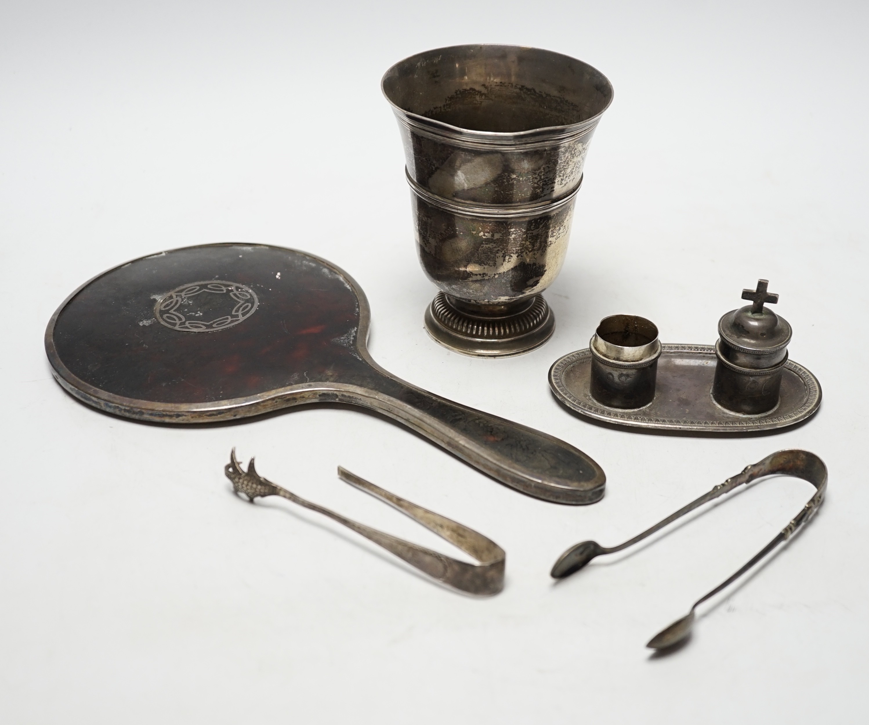 A French white metal small pedestal vase, 10.8cm, a silver and tortoiseshell mounted hand mirror and three other items including a pair of silver sugar tongs.